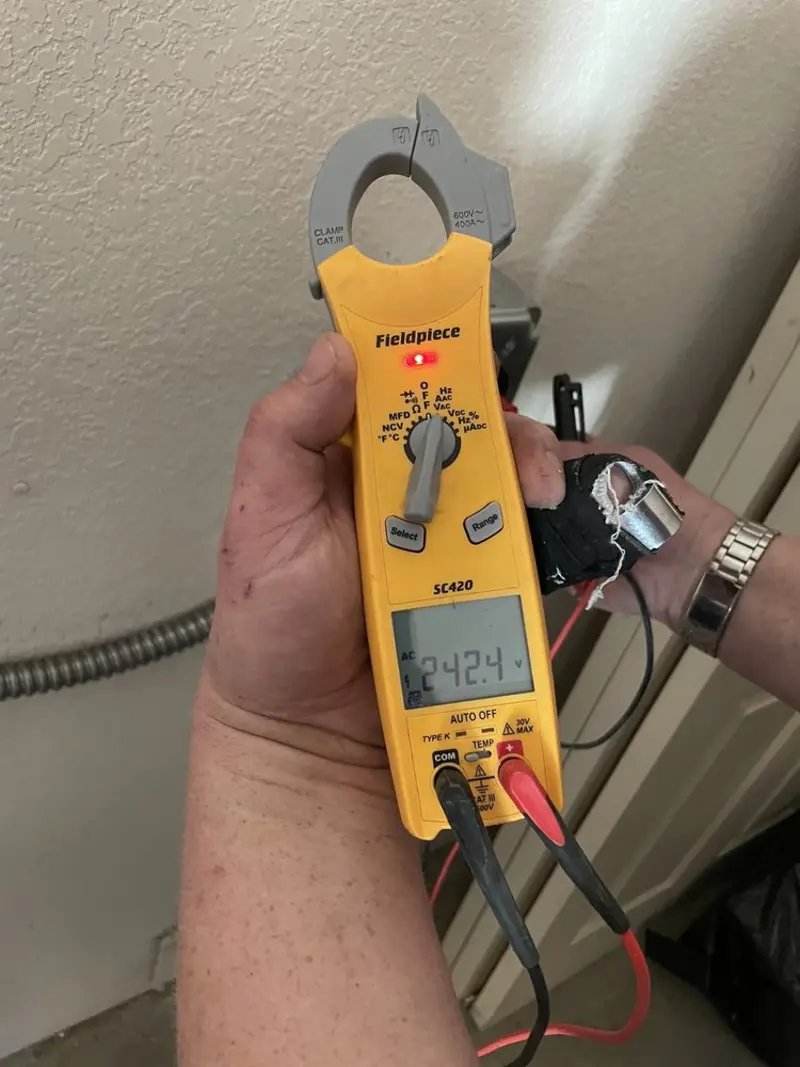 Voltage testing with clamp meter during Outlet Installation in Kensington